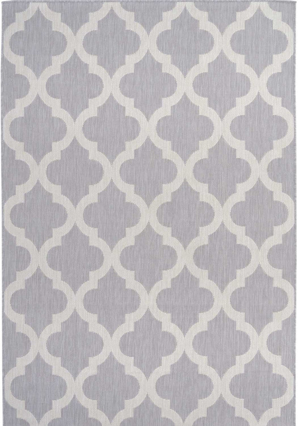Grey Moroccan trellis outdoor rug on a British garden patio