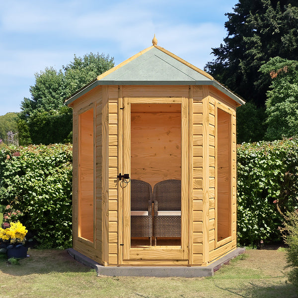 Shire Kendall timber summerhouse with apex roof and glazed doors in a British garden