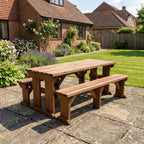 Aspen Picnic Table and Benches Set in rustic brown finish in a garden