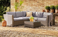 Chesterton Grey 5 Seater Rattan Garden Corner Sofa Set in a British garden
