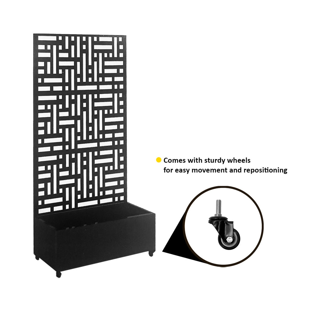 Black metal privacy screen with planter used as a patio divider