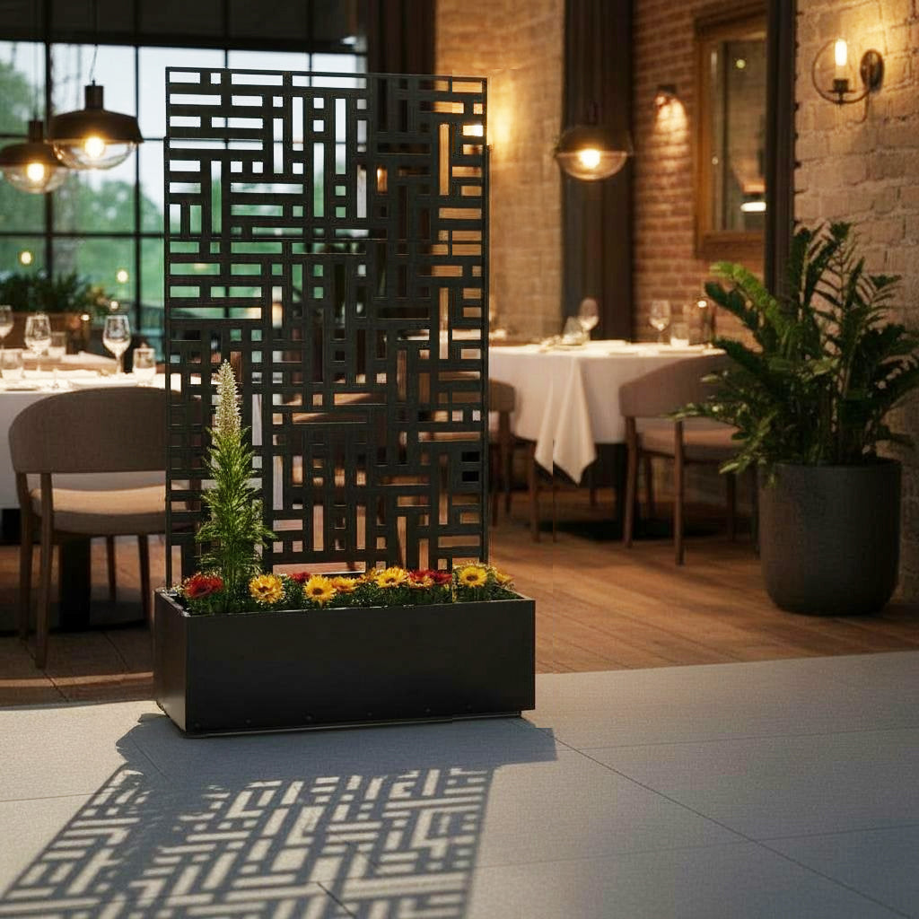 Black metal privacy screen with planter showing removable wheels at the base
