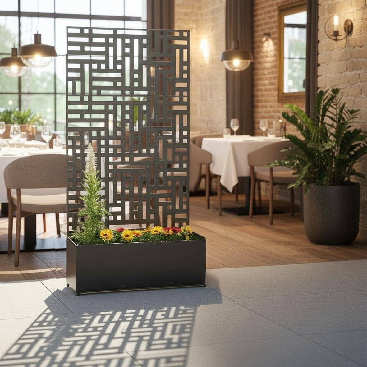 Anthracite grey metal privacy screen with planter, detail of geometric pattern
