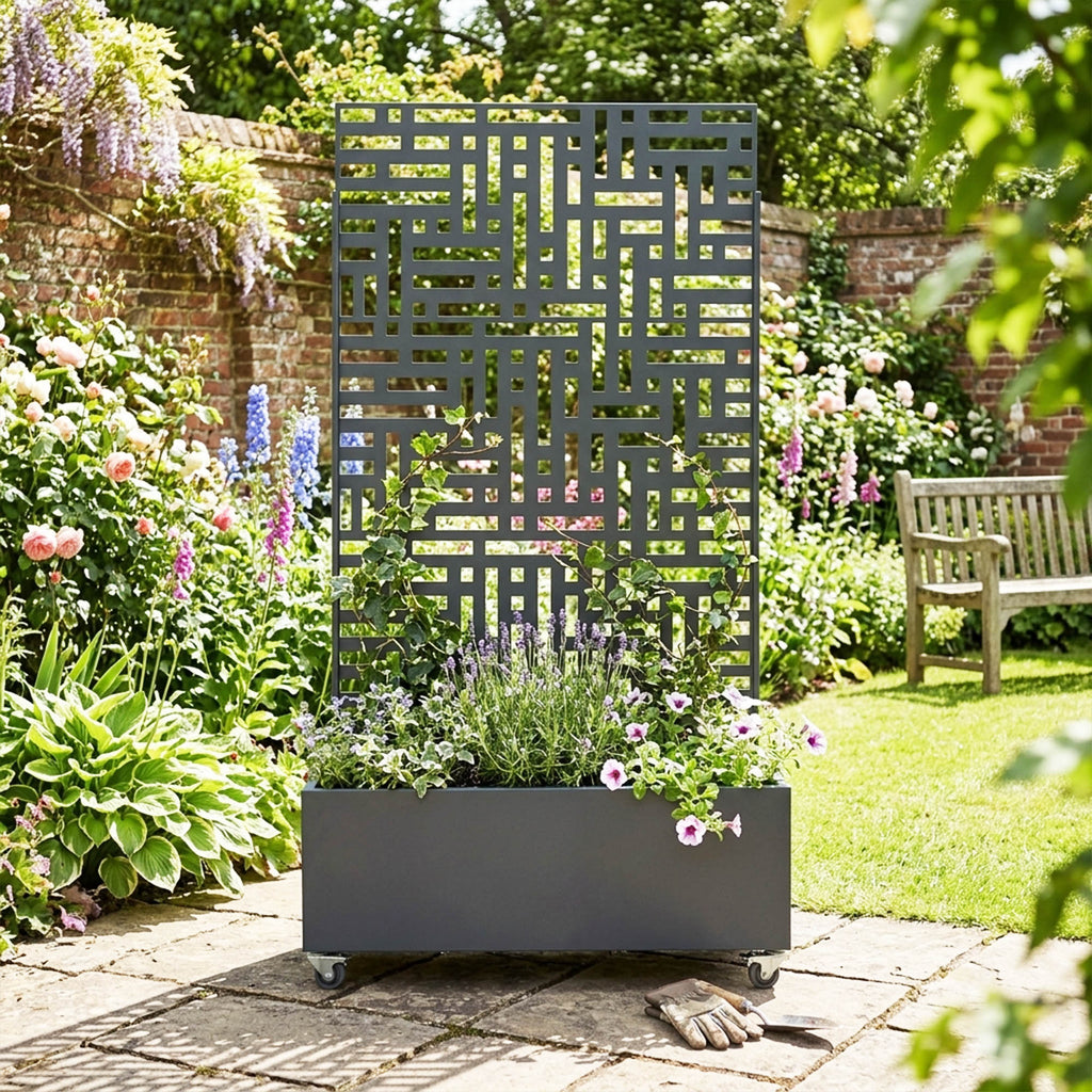 Anthracite grey metal privacy screen with planter in a garden setting