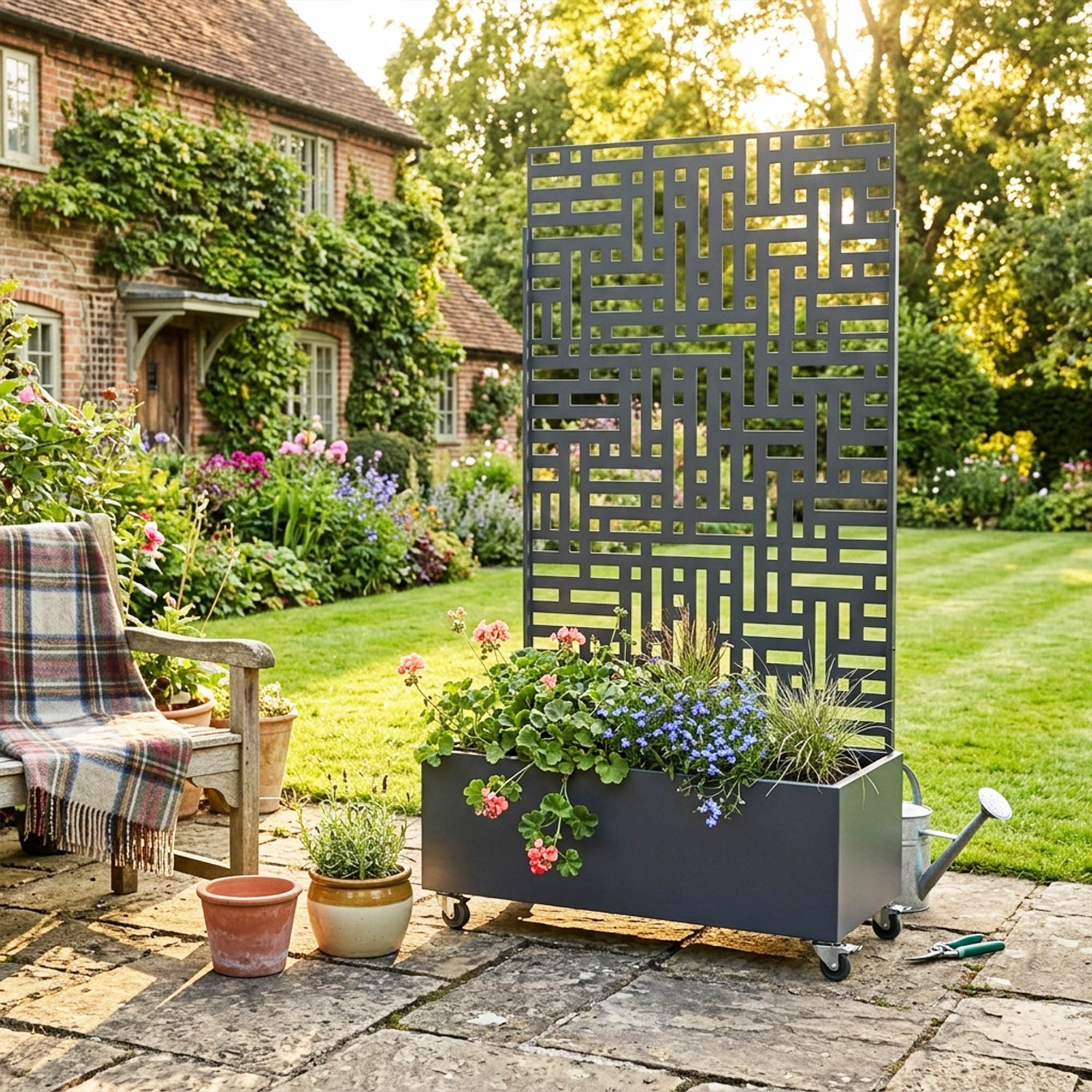 Anthracite grey metal privacy screen with planter, full-height view